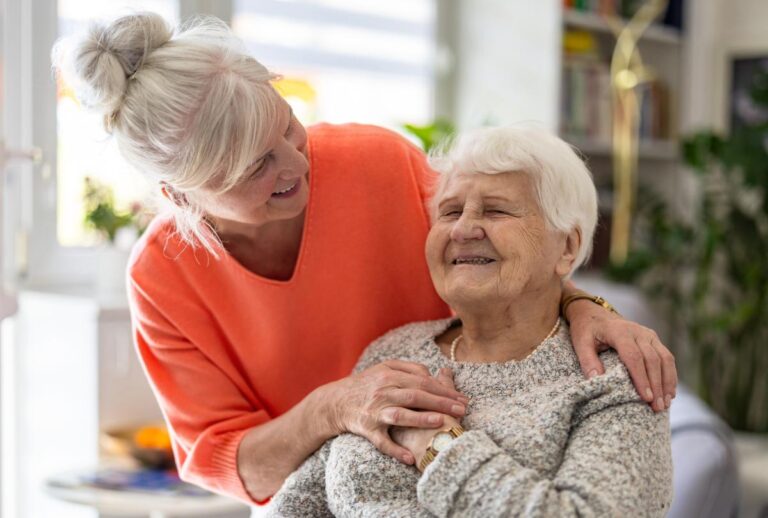 Carrollton Gardens | Caregiver comforting a resident