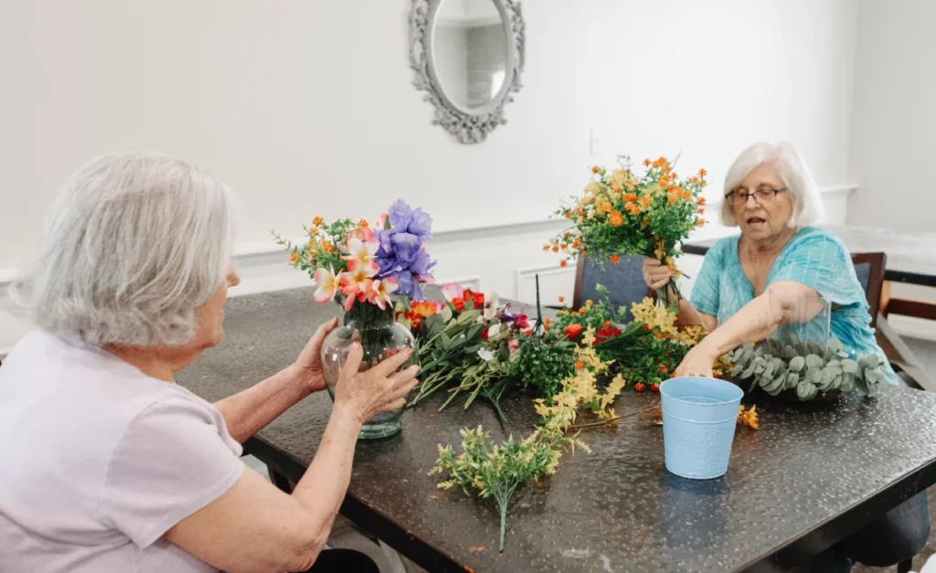 Carrollton Gardens | Senior women arranging flowers