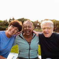 Carrollton Gardens | Group of smiling seniors outside together